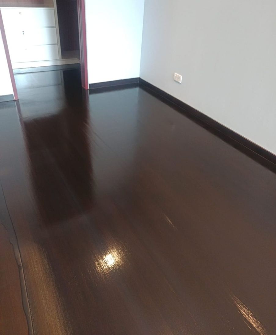 Ebony-stained parquet reflecting light