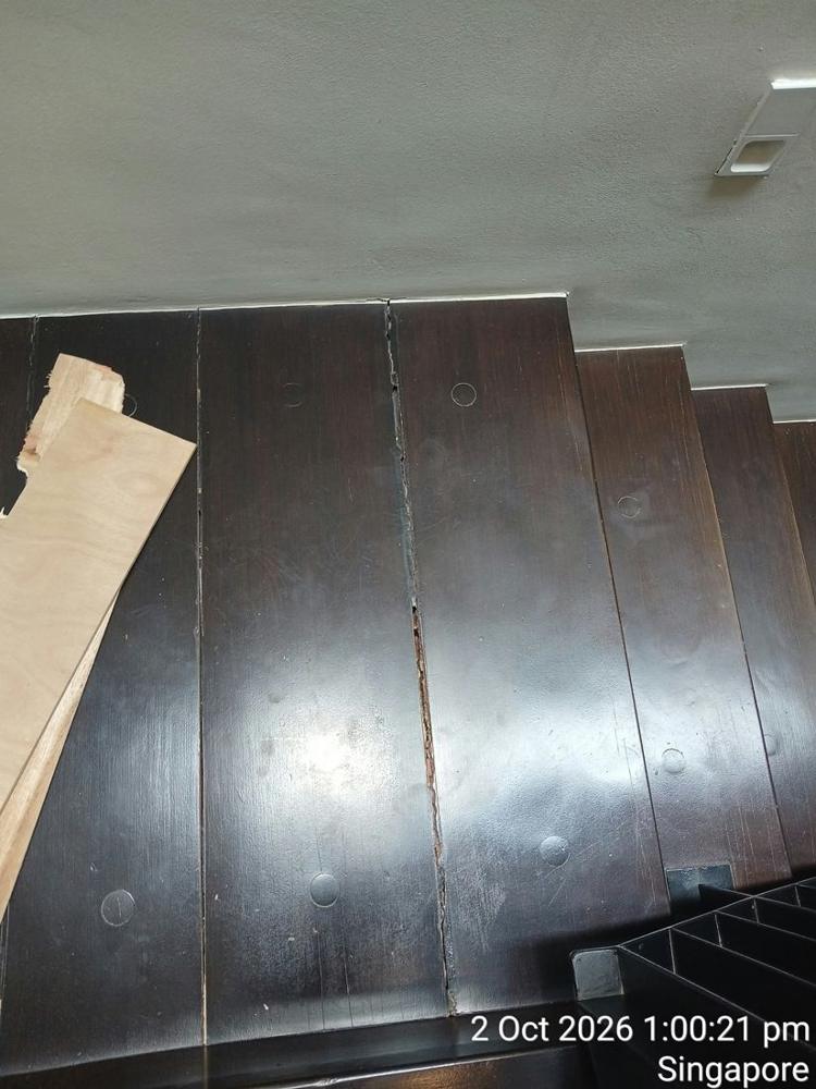 Dark timber stair treads with new timber ready for repair