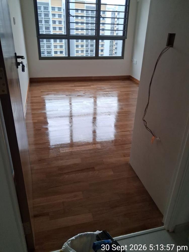 Dark parquet in an HDB bedroom after gloss varnish