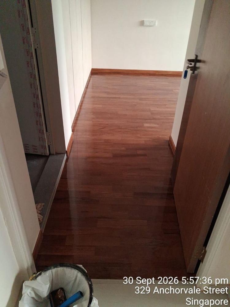 Varnished parquet corridor in an HDB flat