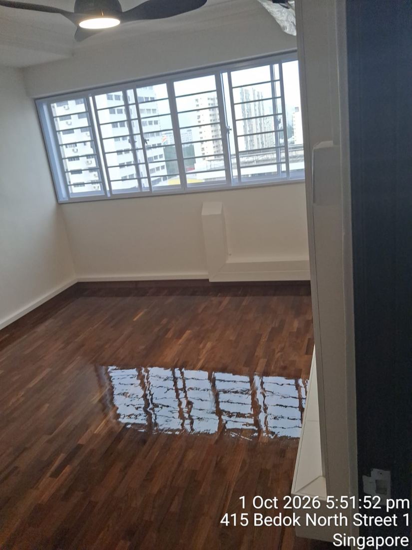 Glossy varnished strip parquet in an HDB flat
