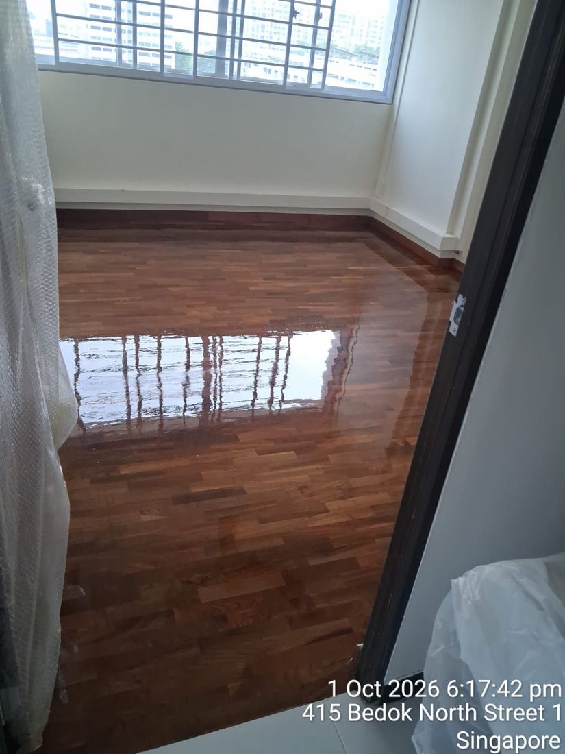 Varnished bedroom parquet in an HDB flat