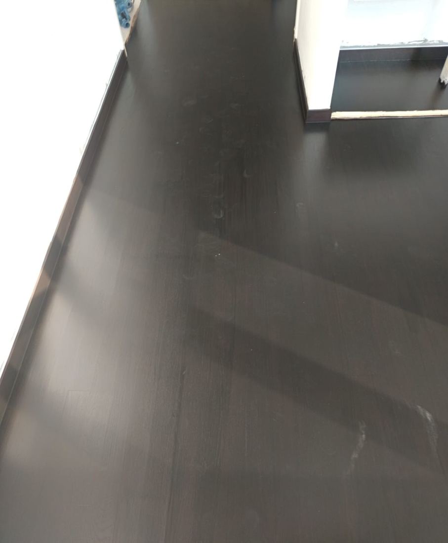 Dark satin parquet in a corridor