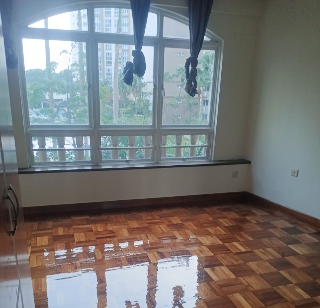 Mosaic parquet bedroom with arched window