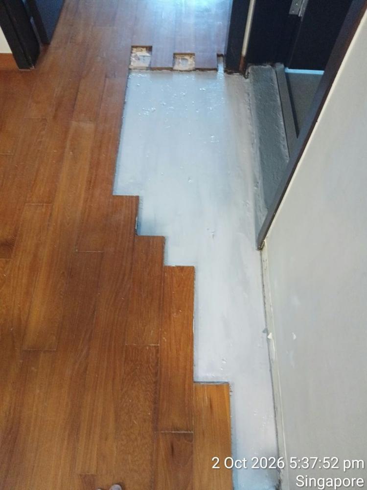 Section of strip parquet removed and screed cleaned for relaying