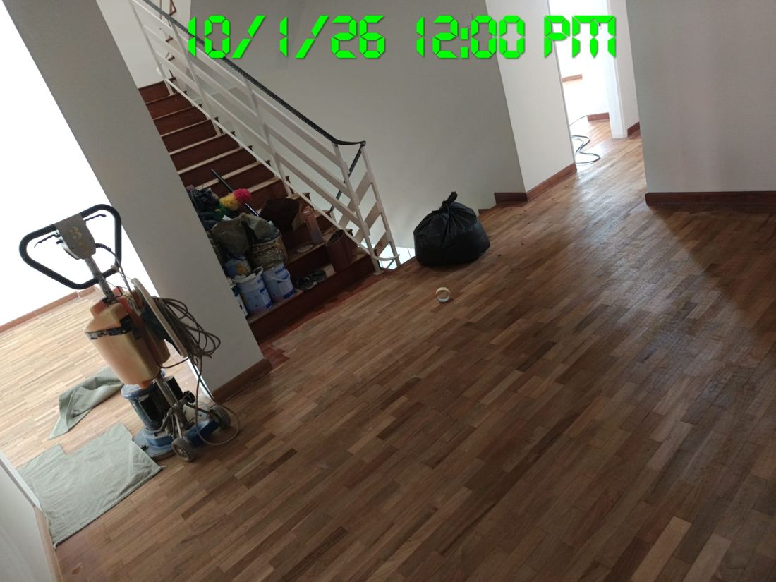 Drum sander set up in a hallway before parquet sanding