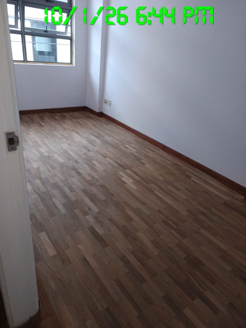 Parquet room next to a window after sanding
