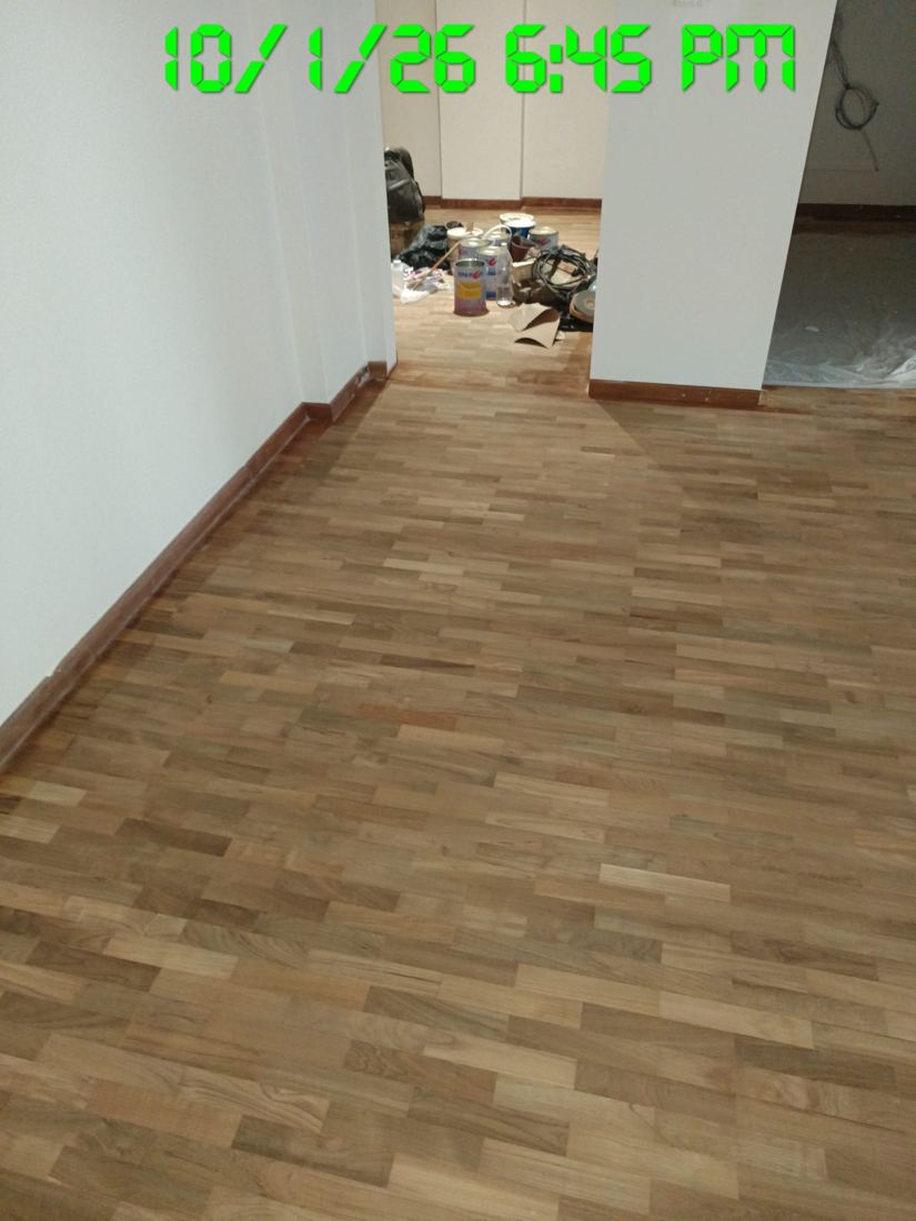 Parquet floor after sanding with furniture moved out