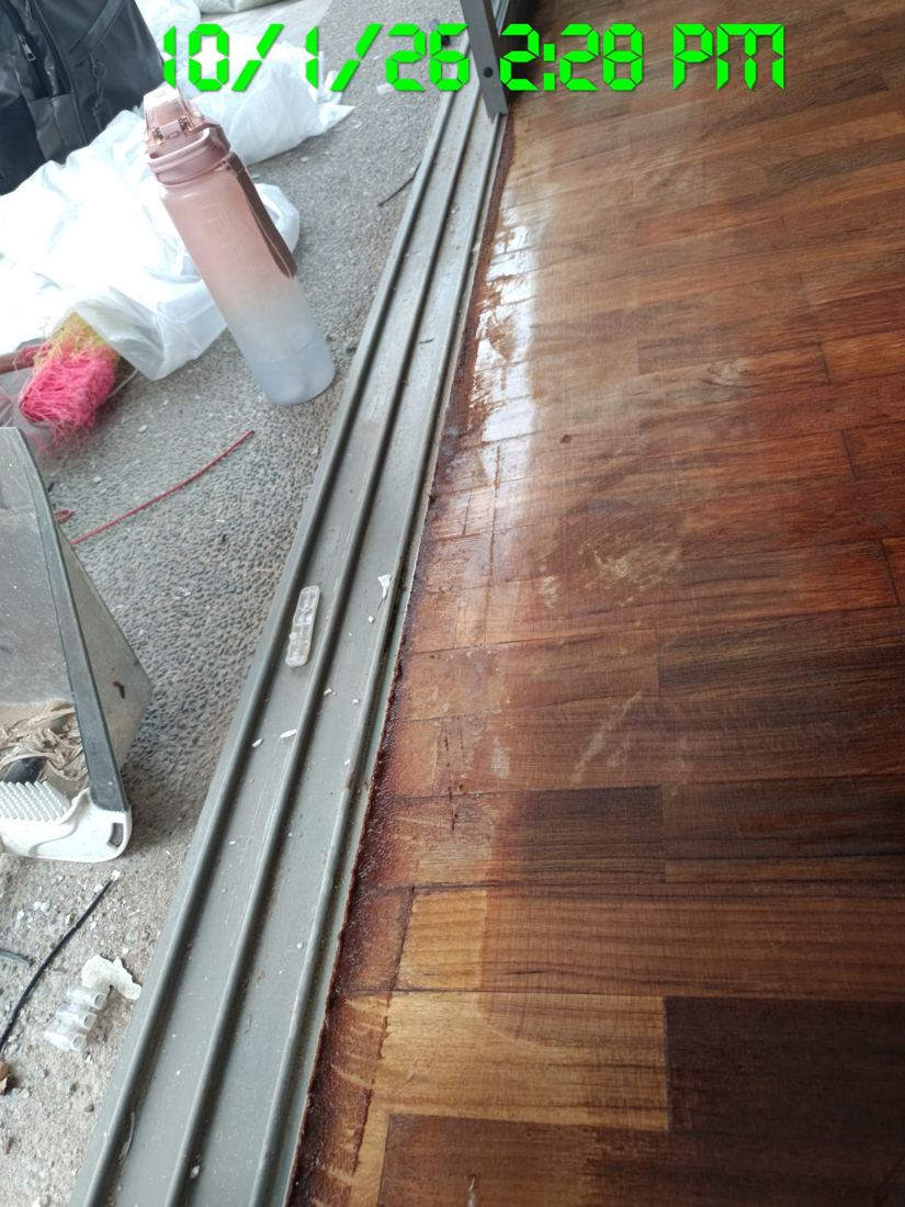 Parquet along a sliding door track after the first coat
