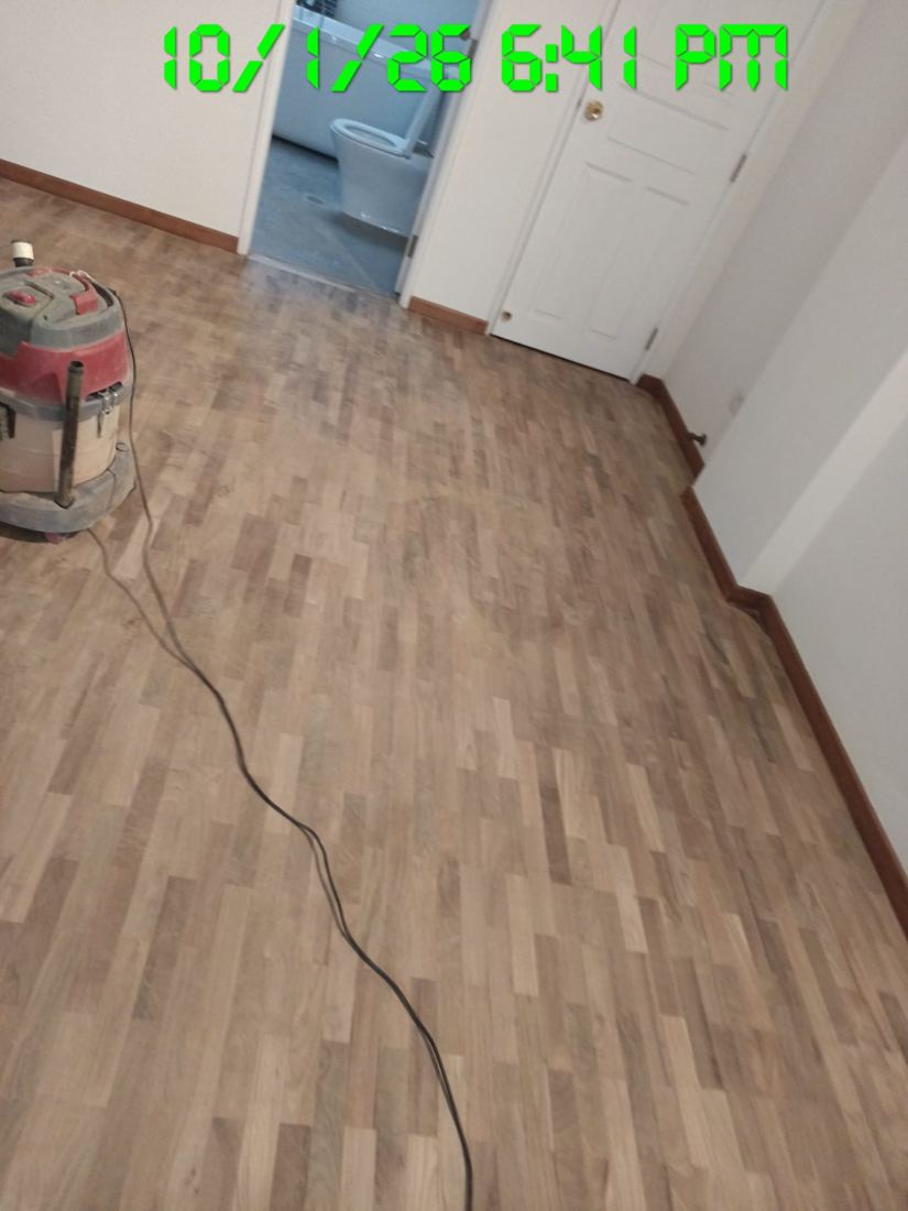 Sanded parquet with an industrial vacuum used for dust control