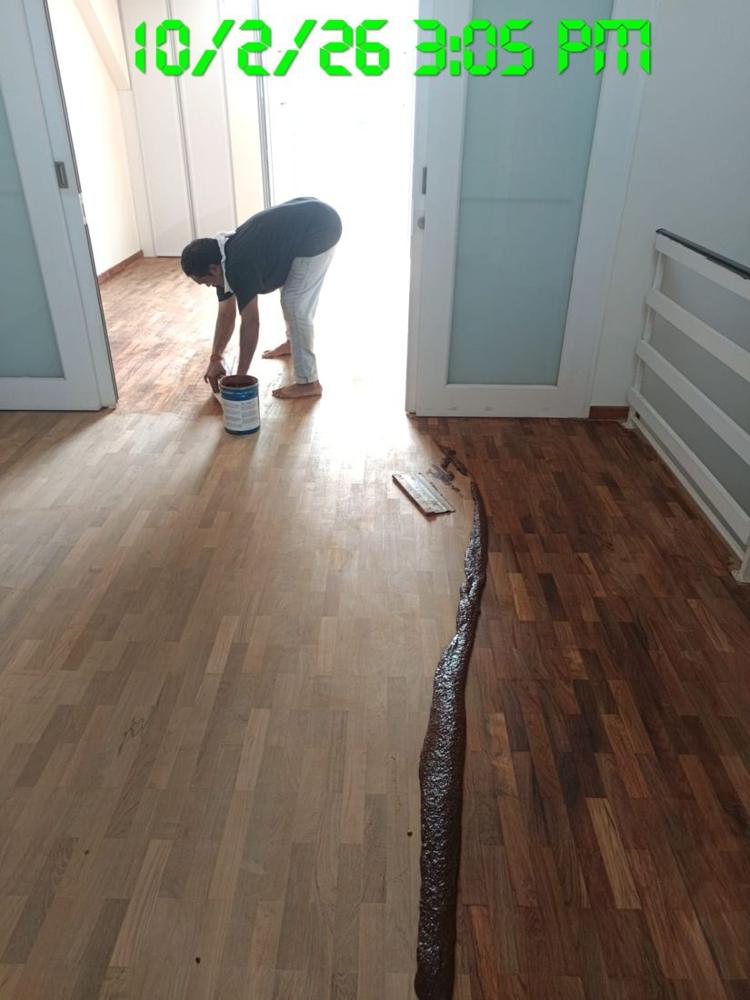 Sealer being applied over freshly sanded parquet