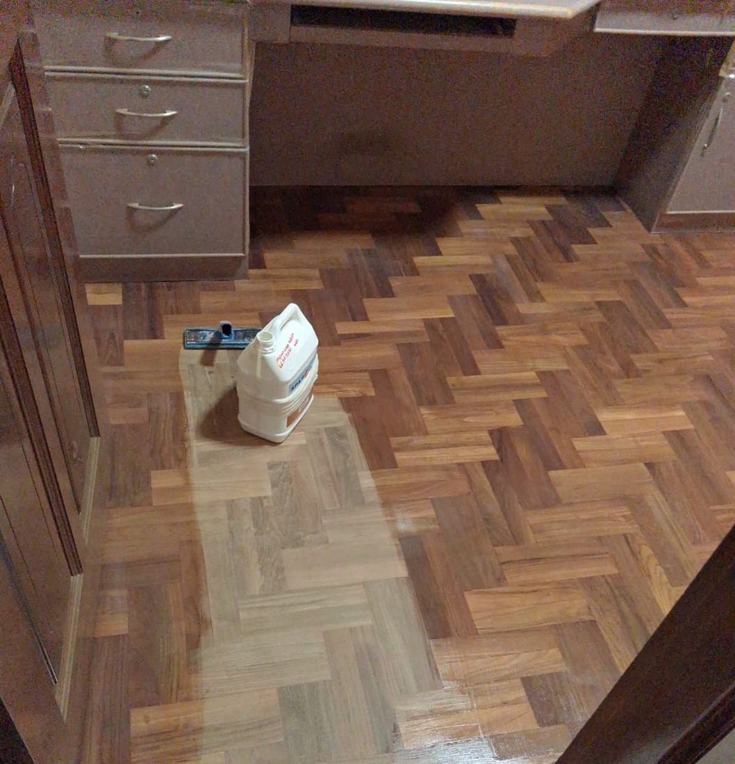 Teak herringbone parquet under a study desk after polishing