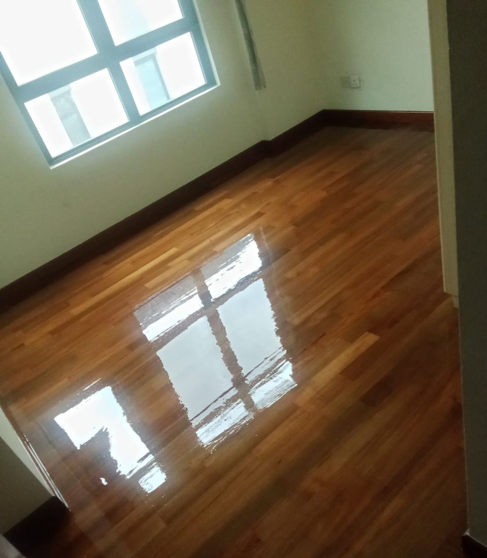Teak strip parquet in an HDB bedroom after varnish