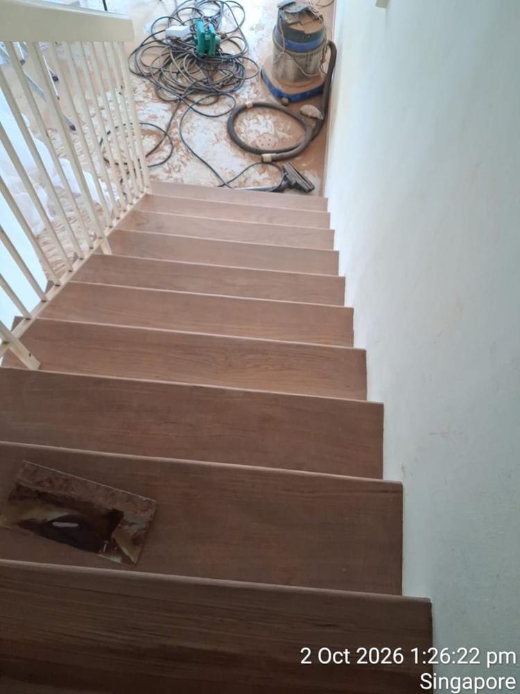 Varnished timber staircase seen from the top