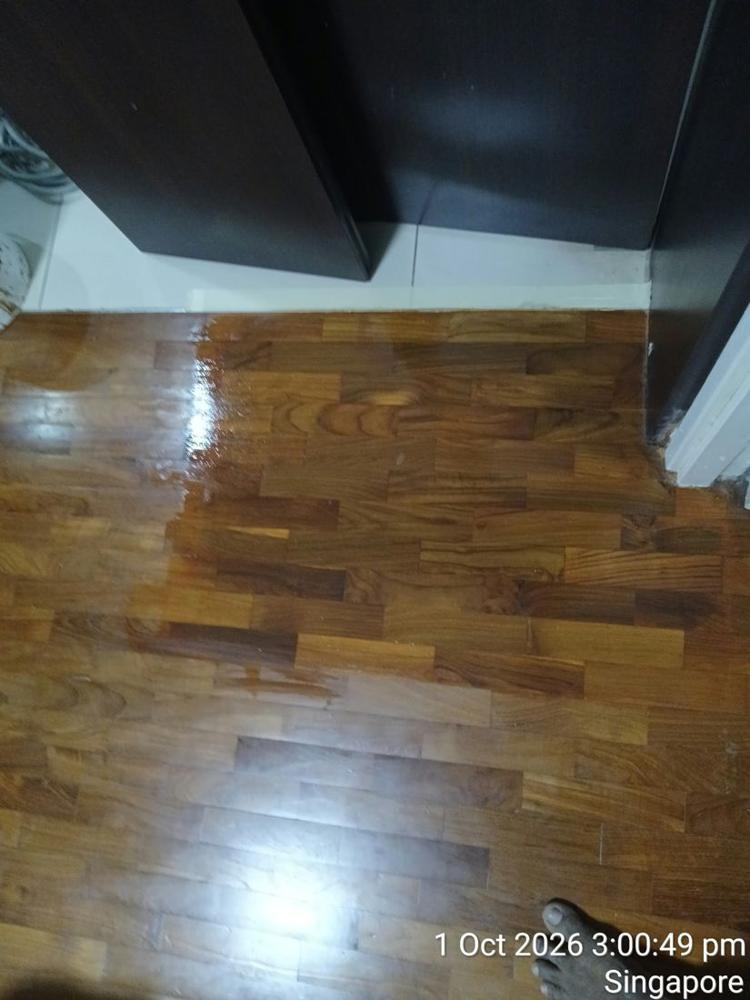 Teak strip parquet in a Toa Payoh HDB flat after repair and varnish