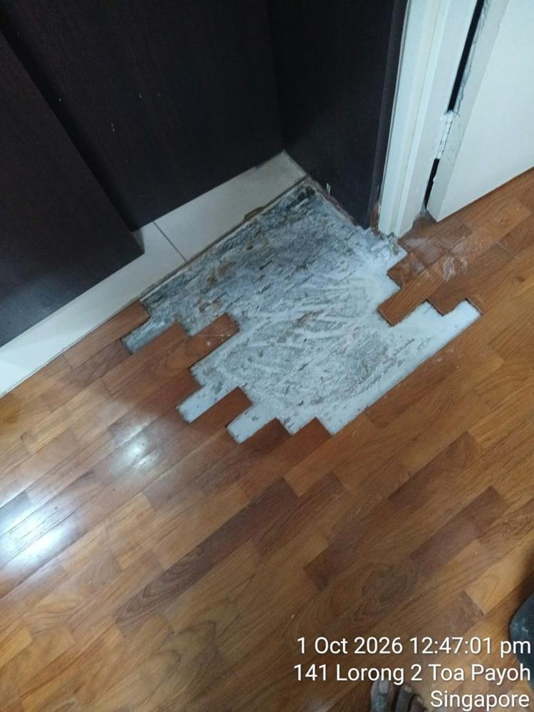 Section of loose parquet removed for re-gluing in a Toa Payoh HDB flat
