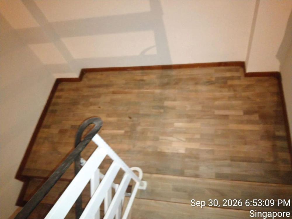 Worn timber stair landing before sanding