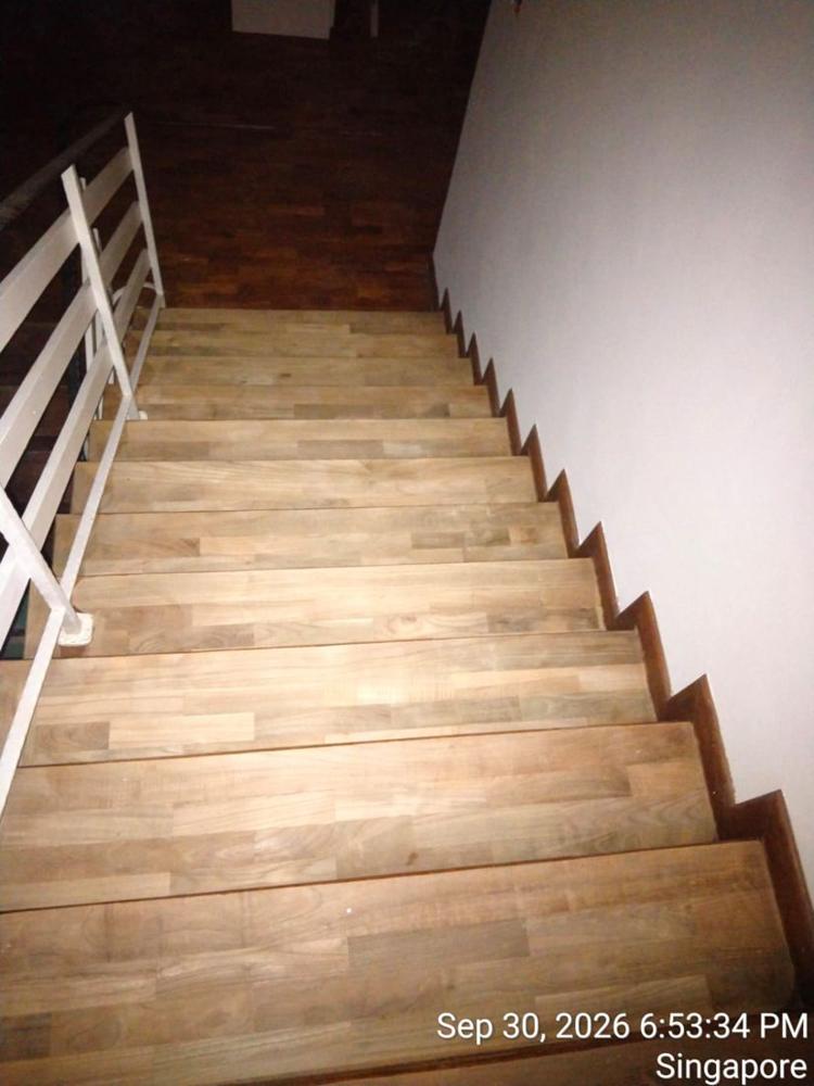 Worn teak staircase before sanding